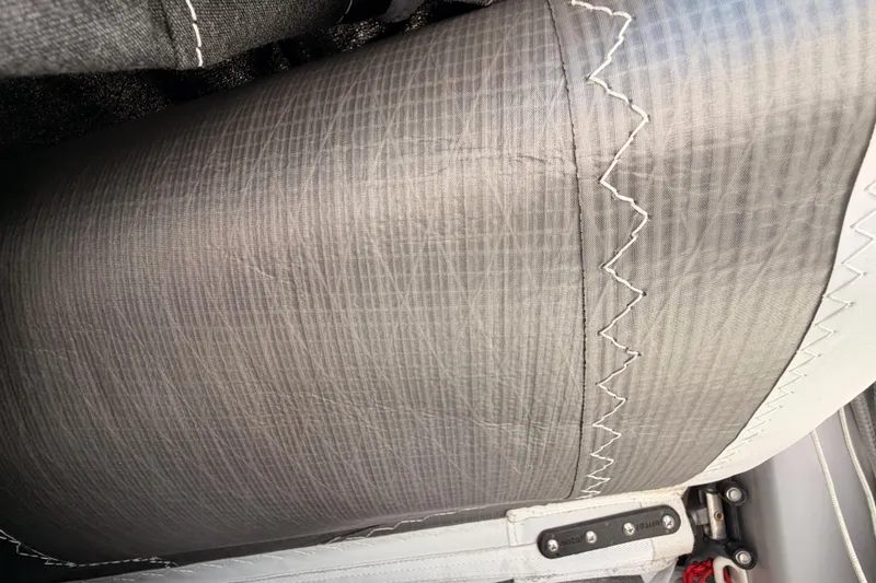 Slide: The Image of Close-up of Jeanneau Sun Odyssey 350 sail stitching, 2025 model. - 37