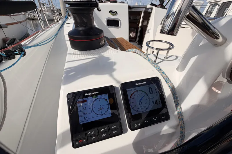 Slide: The Image of 2025 Jeanneau Sun Odyssey 350 cockpit with Raymarine navigation displays and winch. - 42