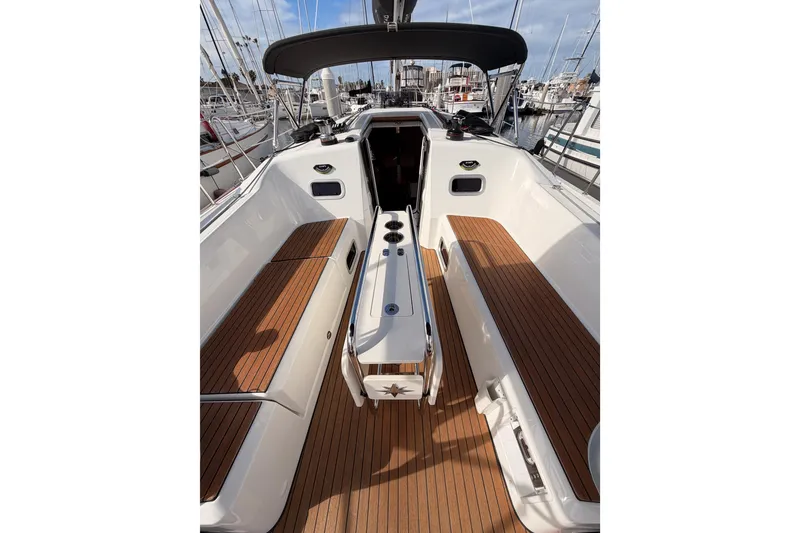 Slide: The Image of 2025 Jeanneau Sun Odyssey 350 sailboat cockpit with teak flooring and modern design. - 44