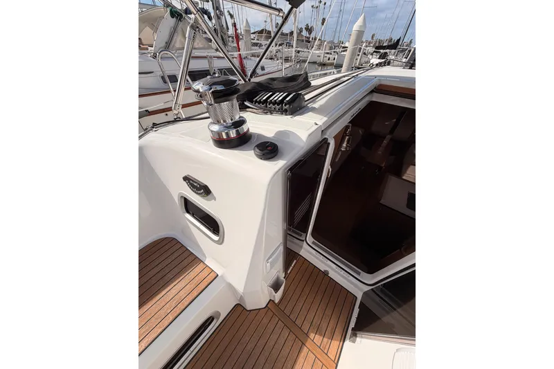 Slide: The Image of 2025 Jeanneau Sun Odyssey 350 yacht deck with winch and teak flooring. - 48