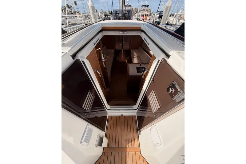 Slide: The Image of 2025 Jeanneau Sun Odyssey 350 yacht interior view with open cabin doors. - 50