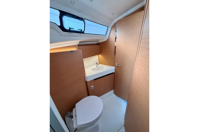 Slide: The Image of Modern bathroom interior of 2025 Jeanneau Sun Odyssey 350 yacht, featuring sleek design and wood accents. - 71