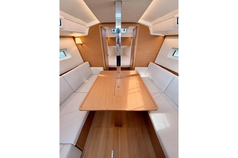 Slide: The Image of Interior of 2025 Jeanneau Sun Odyssey 350, featuring elegant wood finishes and comfortable seating. - 78