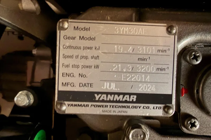 Slide: The Image of Yanmar engine plate on Jeanneau Sun Odyssey 350, manufactured July 2024, model 3YM30AE. - 91