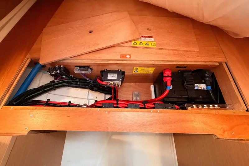 Slide: The Image of Electrical system of 2025 Jeanneau Sun Odyssey 350 sailboat, featuring wiring and battery components. - 94