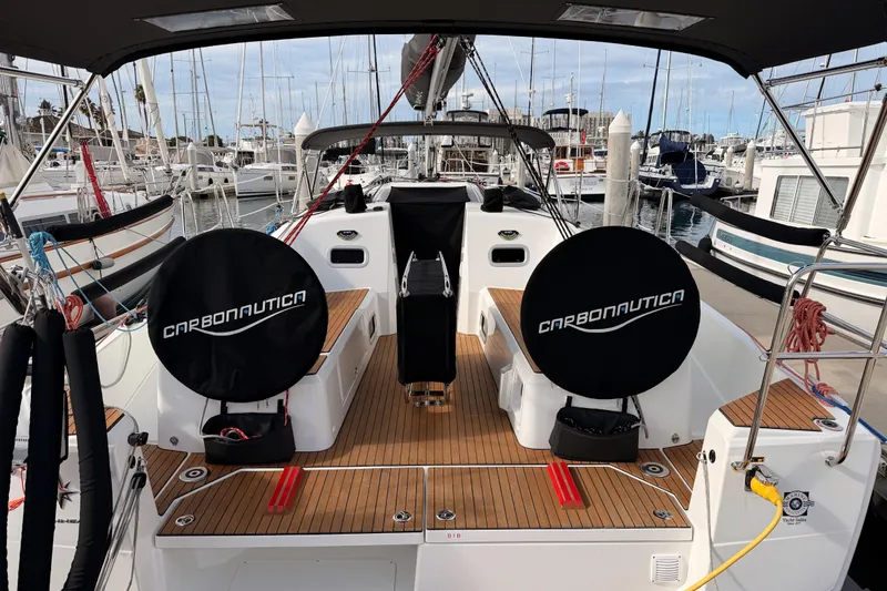 Slide: The Image of 2025 Jeanneau Sun Odyssey 350 yacht cockpit with Carbonautica wheels in marina. - 98