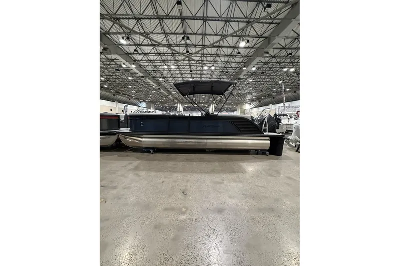The Image of 2026 Flagship Discover 22CU pontoon boat with extended deck in showroom. - 1