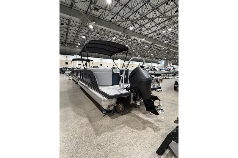 Slide: The Image of 2026 Flagship Discover 22CU pontoon boat with extended deck in showroom. - 3