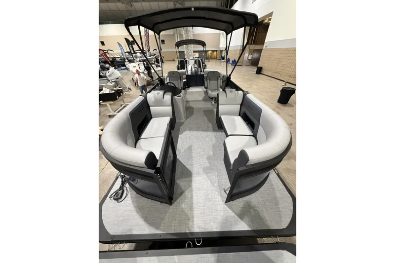 Slide: The Image of 2026 Flagship Discover 22CU boat with extended deck, featuring spacious seating and canopy. - 6