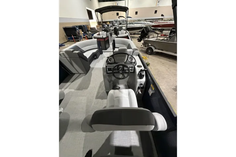 Slide: The Image of 2026 Flagship Discover 22CU boat interior with extended deck, featuring modern seating and control panel. - 7