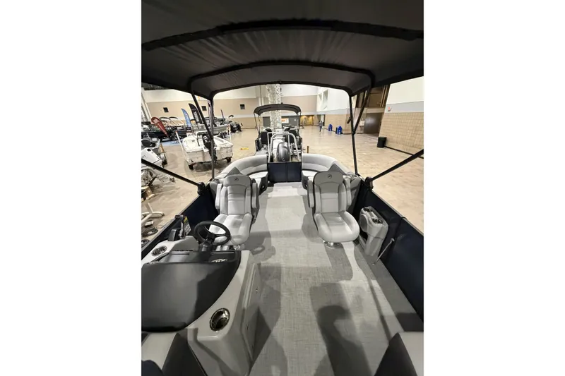 Slide: The Image of 2026 Flagship Discover 22CU boat interior with extended deck, featuring modern seating and helm. - 8