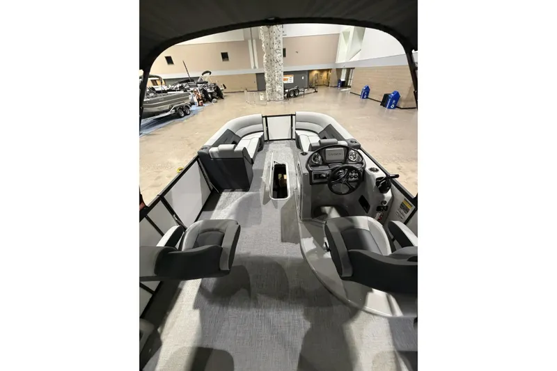 Slide: The Image of 2026 Flagship Discover 22 Rear Fish boat interior with extended rear deck, showcasing seating and controls. - 10