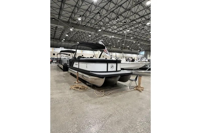 Slide: The Image of 2026 Flagship Discover 22 Rear Fish boat with extended rear deck in showroom. - 3