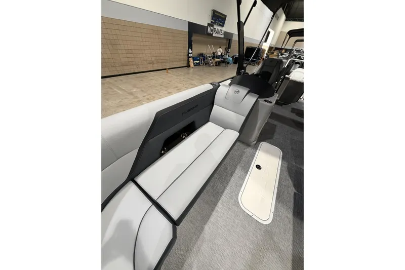 Slide: The Image of 2026 Flagship Discover 22 boat interior with sleek seating and extended rear deck. - 7