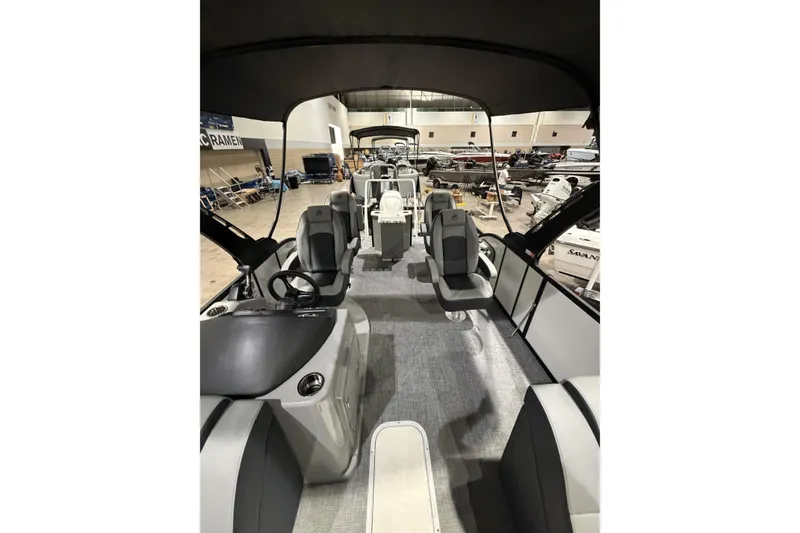 Slide: The Image of 2026 Flagship Discover 22 Rear Fish boat interior with extended rear deck, featuring modern seating. - 9