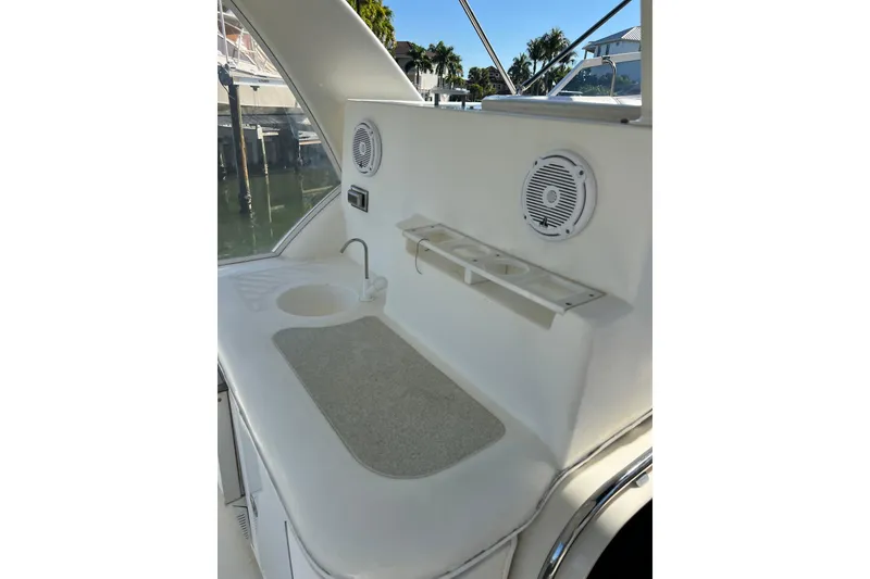 Slide: The Image of White captain's chair on 2004 Cruisers Yachts 3750 Motoryacht deck. - 16