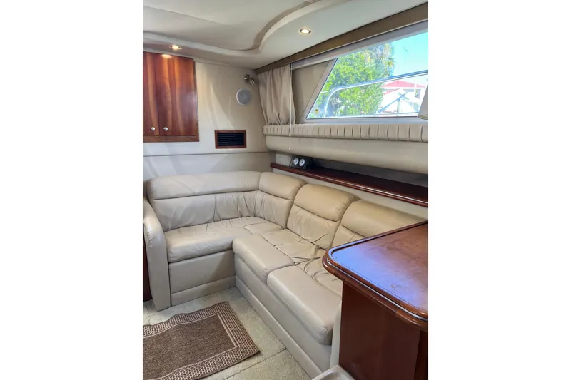 Slide: The Image of 2004 Cruisers Yachts 3750 Motoryacht interior with wooden cabinetry and compact kitchen area. - 20