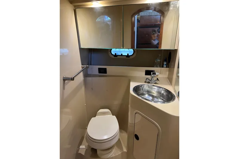 Slide: The Image of 2004 Cruisers Yachts 3750 Motoryacht interior cabin with plush mattress and window view. - 23