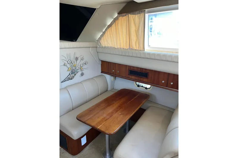 Slide: The Image of 2004 Cruisers Yachts 3750 Motoryacht interior with stairs, seating, and elegant wood finishes. - 25