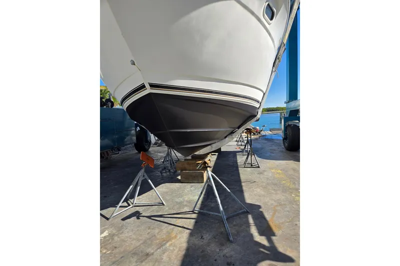 Slide: The Image of 2004 Cruisers Yachts 3750 Motoryacht on stands, hull view, outdoor setting. - 37