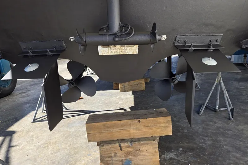 Slide: The Image of 2004 Cruisers Yachts 3750 Motoryacht propellers and rudders in dry dock. - 32