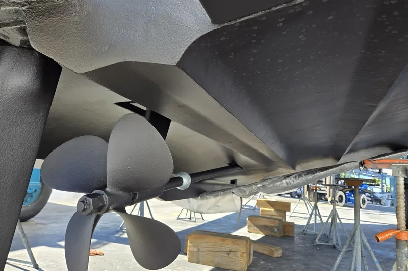 Slide: The Image of 2004 Cruisers Yachts 3750 Motoryacht propeller and hull in dry dock. - 36