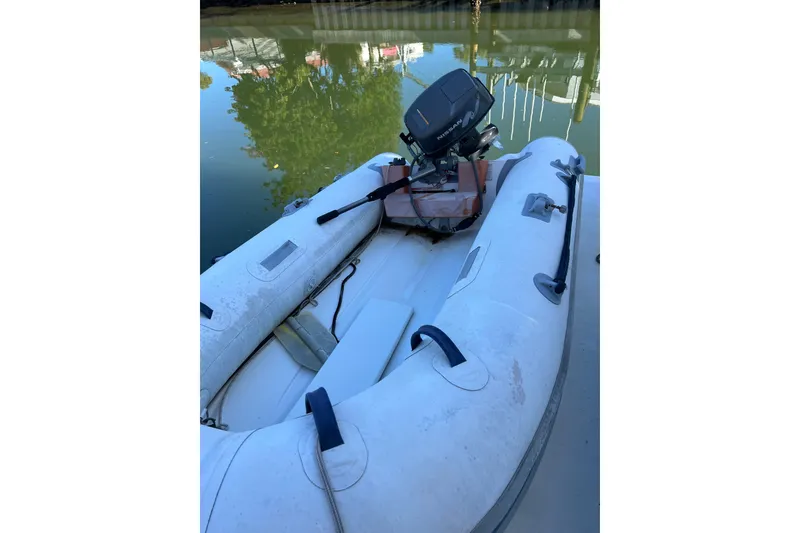 Slide: The Image of Inflatable boat with motor on water, near 2004 Cruisers Yachts 3750 Motoryacht. - 6