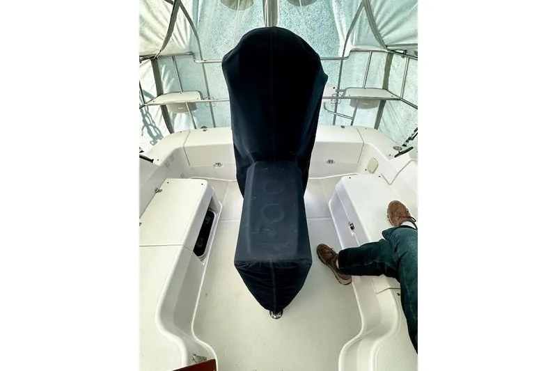 Slide: The Image of Interior view of a 2015 Catalina 315 sailboat cockpit with covered helm. - 10