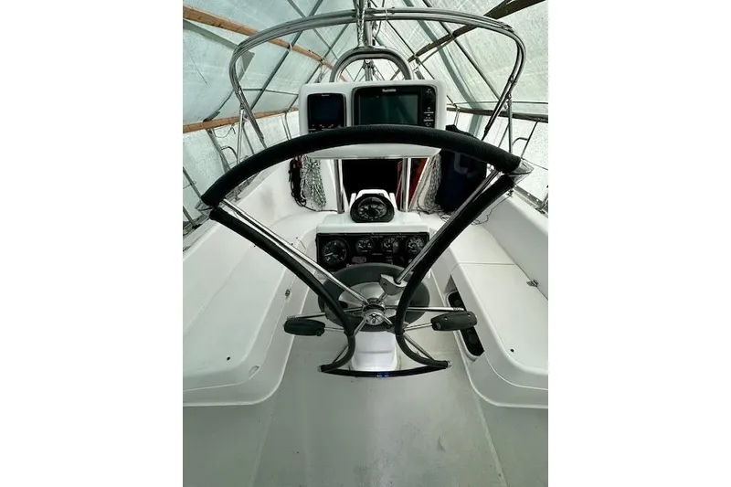 Slide: The Image of Cockpit of 2015 Catalina 315 sailboat with steering wheel and navigation instruments. - 11