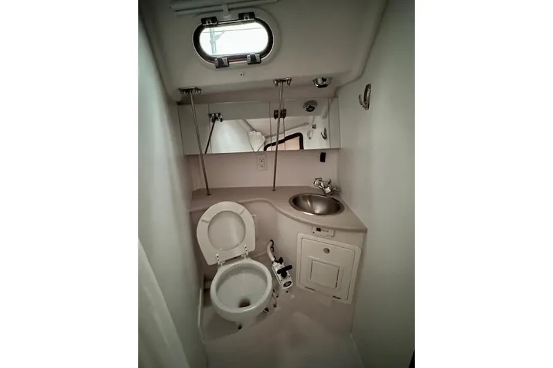 Slide: The Image of Compact bathroom in a 2015 Catalina 315 sailboat with toilet, sink, and mirror. - 26