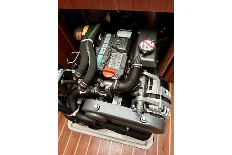 Slide: The Image of Engine compartment of a 2015 Catalina 315 sailboat, showcasing detailed mechanical components. - 30