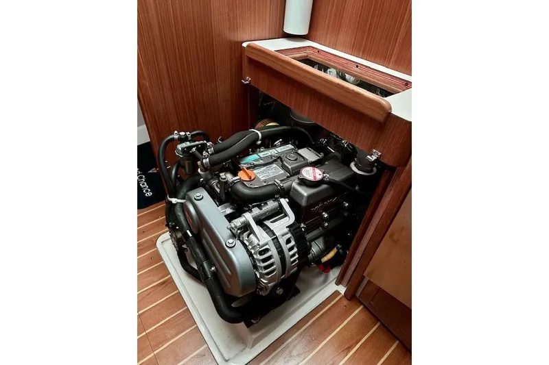 Slide: The Image of Engine compartment of a 2015 Catalina 315 sailboat, showcasing detailed mechanical components. - 31