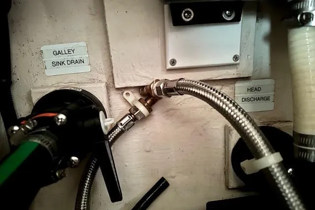 Slide: The Image of Plumbing system of a 2015 Catalina 315 boat, showing galley sink drain and head discharge. - 33