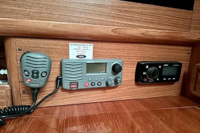 Slide: The Image of 2015 Catalina 315 yacht interior with communication and audio equipment. - 36