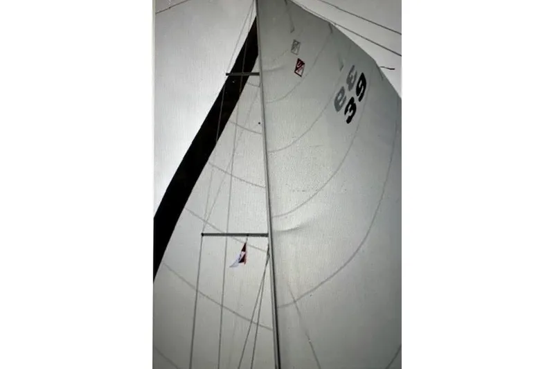 Slide: The Image of Sail of a 2015 Catalina 315 yacht, showcasing its rigging and sail number. - 4