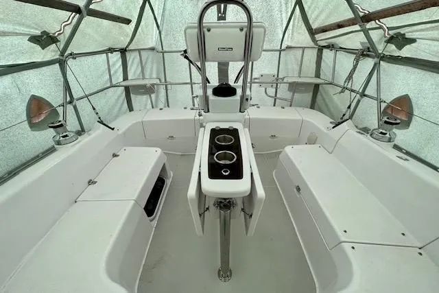 Slide: The Image of 2015 Catalina 315 sailboat cockpit with covered seating and central helm station. - 42