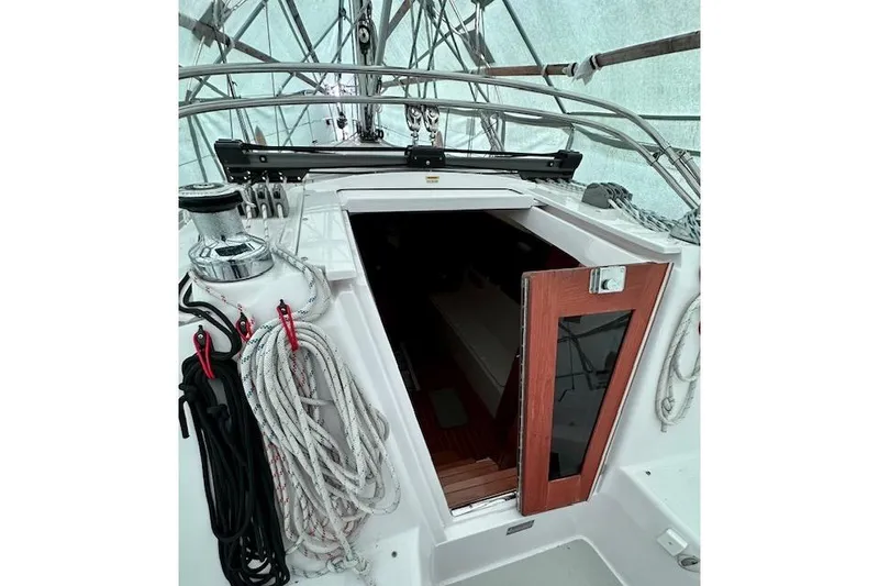 Slide: The Image of 2015 Catalina 315 sailboat cockpit with ropes and open cabin door. - 43