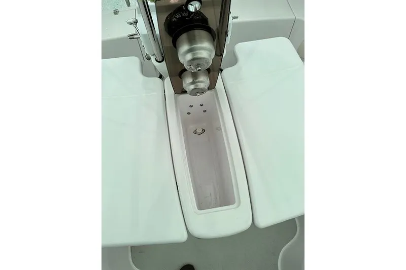 Slide: The Image of Cockpit view of a 2015 Catalina 315 sailboat, featuring a central steering pedestal. - 45