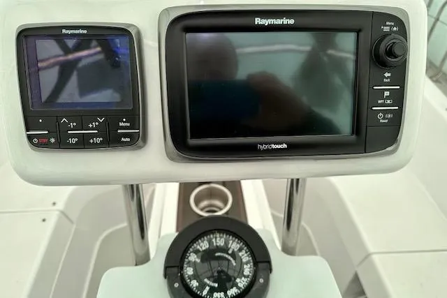 Slide: The Image of Raymarine navigation system and compass on 2015 Catalina 315 yacht dashboard. - 51
