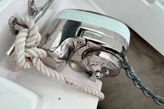 Slide: The Image of Anchor windlass on 2015 Catalina 315 sailboat with secured rope and chain. - 57