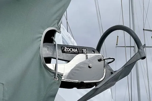 Slide: The Image of Rocna anchor on a 2015 Catalina 315 sailboat, secured with a protective cover. - 63