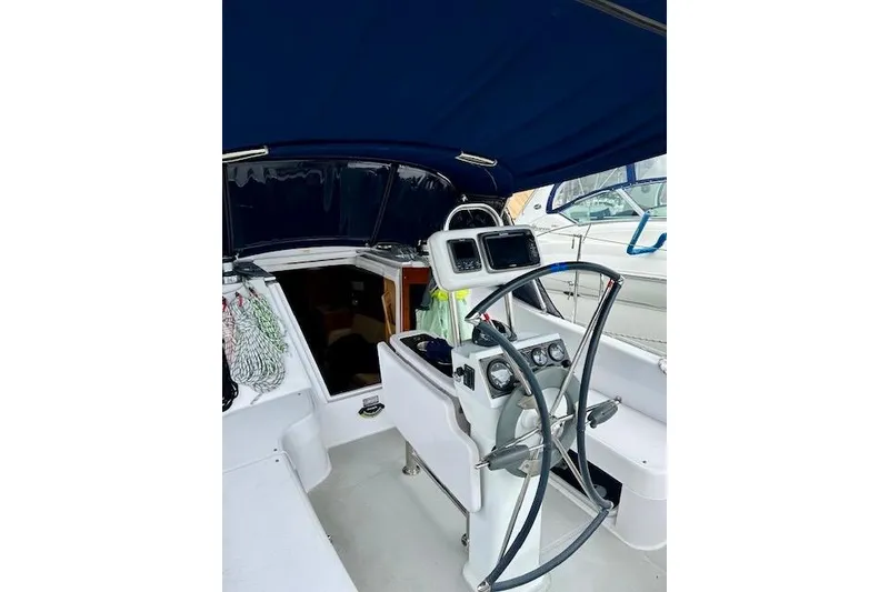 Slide: The Image of Cockpit of 2015 Catalina 315 sailboat with steering wheel and navigation instruments. - 68