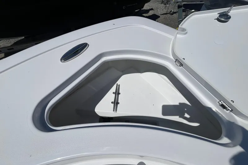 Slide: The Image of Open storage compartment on 2026 Sportsman Heritage 231 Center Console boat. - 10