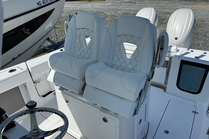 Slide: The Image of 2026 Sportsman Open 262 Center Console with dual seats and steering wheel. - 13