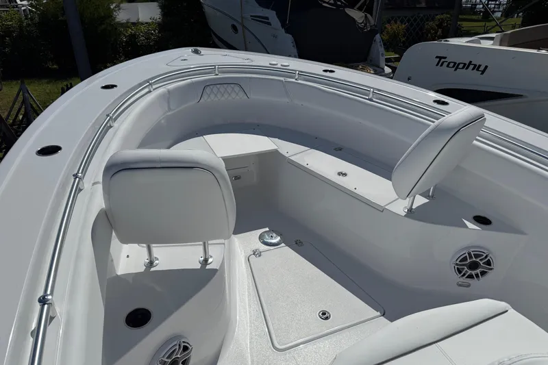 Slide: The Image of 2026 Sportsman Open 262 Center Console boat interior with seating and speakers. - 17
