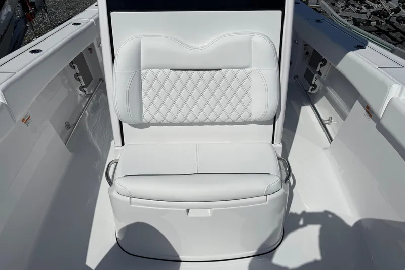 Slide: The Image of 2026 Sportsman Open 262 Center Console boat seat with white cushioned design. - 19