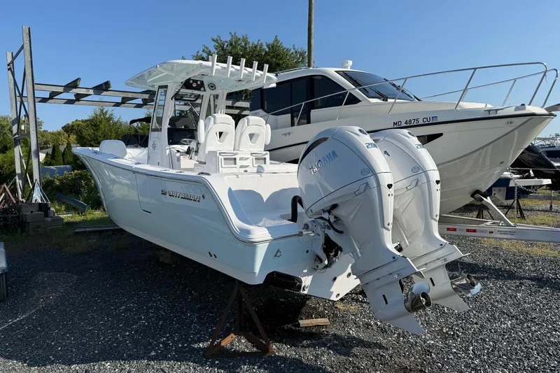 Slide: The Image of 2026 Sportsman Open 262 Center Console boat with dual Yamaha engines on display. - 2