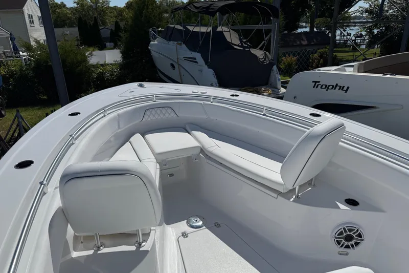 Slide: The Image of 2026 Sportsman Open 262 Center Console boat with white seating and sleek design. - 20