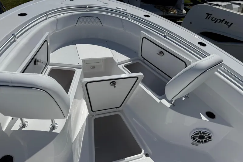 Slide: The Image of 2026 Sportsman Open 262 Center Console boat with open storage compartments and seating. - 21
