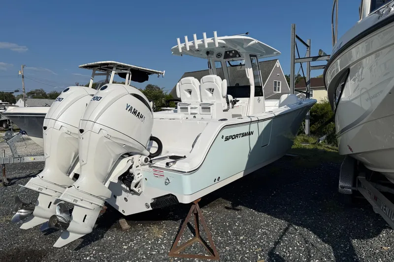 Slide: The Image of 2026 Sportsman Open 262 Center Console boat with twin Yamaha engines on display. - 4